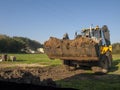 wheel loader during backfilling around the foundation of the building Royalty Free Stock Photo