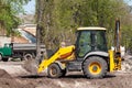Wheel loader Excavator with back hoe loading sand Royalty Free Stock Photo