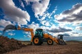 Wheel loader excavator with field background during earthmoving work, construction building Royalty Free Stock Photo