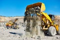 Wheel loader excavator at granite or iron ore opencast mine