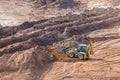 Wheel loader excavator machine working in construction site. wheel loader at sandpit during earthmoving works Royalty Free Stock Photo