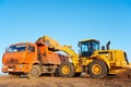 Wheel loader excavator and tipper dumper Royalty Free Stock Photo