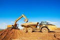 Wheel loader excavator and tipper dumper Royalty Free Stock Photo