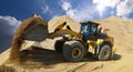 Wheel loader in a gravel pit during mining - heavy construction Royalty Free Stock Photo