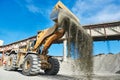 Wheel loader loading granite or ore at sorting plant