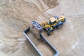 Wheel loader loading sand on dumper truck Royalty Free Stock Photo