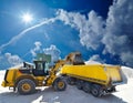 Wheel loader loads a truck with sand in a gravel pit