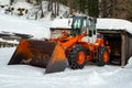 Wheel loader machine with snow chains is ready for the snow removing job Royalty Free Stock Photo