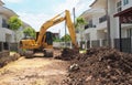 Wheel loader machine unloading clay at moving works in construction site