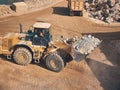 Wheel loader moves soil at construction site Royalty Free Stock Photo