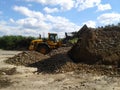 Wheel loader working in a composting facility Royalty Free Stock Photo