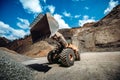 Wheel loader working at gravel during mining ore operations Royalty Free Stock Photo