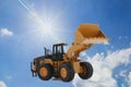 Wheel loaders on  a  sunlight background Royalty Free Stock Photo
