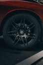 Wheel of luxury, red, sport car, close-up, vertical Royalty Free Stock Photo