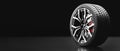 Wheel with modern alu rims on black Royalty Free Stock Photo