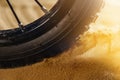 Wheel mountain bike bicycle detail in a sunny day and flying motion sand Royalty Free Stock Photo