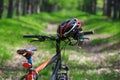 Wheel mountain bike, helmet and sunglasses on a trail in the for