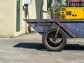 Wheel of an old car. Old technologies. Tvchka for the transport of goods