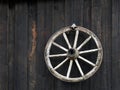 Wheel of an old cart on the wall of the ancient house Royalty Free Stock Photo