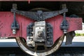 Wheel of the old steam locomotive of red color and the elements of the drive Royalty Free Stock Photo