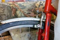 Wheel and part of the handlebars of an old red bicycle Royalty Free Stock Photo