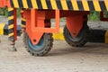 Wheel part view from an vehicle mounted tower ladder with caution stickers on the vehicle