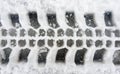 Wheel print in snow Royalty Free Stock Photo