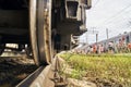 Wheel of a railway car standing on the rails on railway station close up Royalty Free Stock Photo