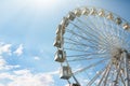 A wheel of review is in the park of entertainments, on a background blue sky Royalty Free Stock Photo