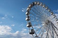 A wheel of review is in the park of entertainments, on a background blue sky Royalty Free Stock Photo