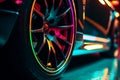 Wheel rim of a speed sports car with vibrant colors and neon lights, exuding a sense of speed and excitement. Racing Car Rims in Royalty Free Stock Photo