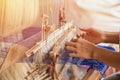 Wheel Spinning Yarn with Yellow Thread to work for Weaving machine and Thai traditional Silk Royalty Free Stock Photo
