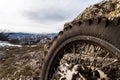 Wheel with spokes and brake disc plus Enduro motorcycle chain. Royalty Free Stock Photo