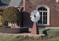 `Wheel of Time`, a stainless steel and dichroic glass piece by Jeff Laing in Edmond, Oklahoma.