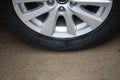 Wheel tire, car tire,vehicle tire, tire and rim, close up black wheel tire on ground. Royalty Free Stock Photo