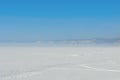 Wheel track on a snow field Royalty Free Stock Photo