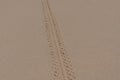 Wheel track tire trace on dust sand Royalty Free Stock Photo