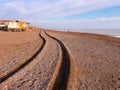 Wheel track of a 4x4 vehicle driving past the beach at sunset Royalty Free Stock Photo