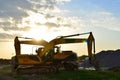 Wheel and tracked heavy excavators working at construction site. hydraulic excavator crane at building site on sunny day