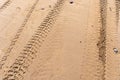 Wheel Tracks on Beach Texture Background, Sand and Rocky Pattern, Red Morocco Beach Royalty Free Stock Photo