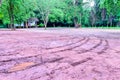 Wheel tracks in outdoor carpark after raining Royalty Free Stock Photo