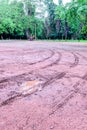 Wheel tracks in outdoor carpark after raining Royalty Free Stock Photo