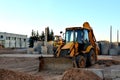 Wheel tractor excavator loader with bucket at construction works in industrial site or sandpit quarry Royalty Free Stock Photo