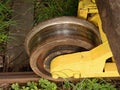 Wheel from a vintage cargo wagon. Old railway wagon of forgotten train in railway depot. Royalty Free Stock Photo