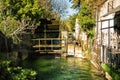 Wheel of a water mill in Medieval village L`Isle-sur-Sorgue, Vaucluse, Provence, France. Famous Sorgue river with green water. Royalty Free Stock Photo