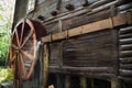 The wheel of the windmill is spinning and running water. An old water mill. Royalty Free Stock Photo