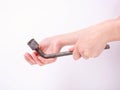 Wheel wrench in hand of the girl. Symbol of hard work, feminism and labor day. Isolate on white background