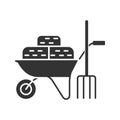 Wheelbarrow with bales of hay and pitchfork glyph icon