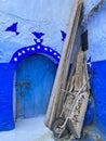 Wheelbarrow in blue corner of Chefchauen, the blue city of Morocco