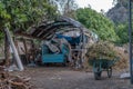 Wheelbarrow and truck on farm Royalty Free Stock Photo